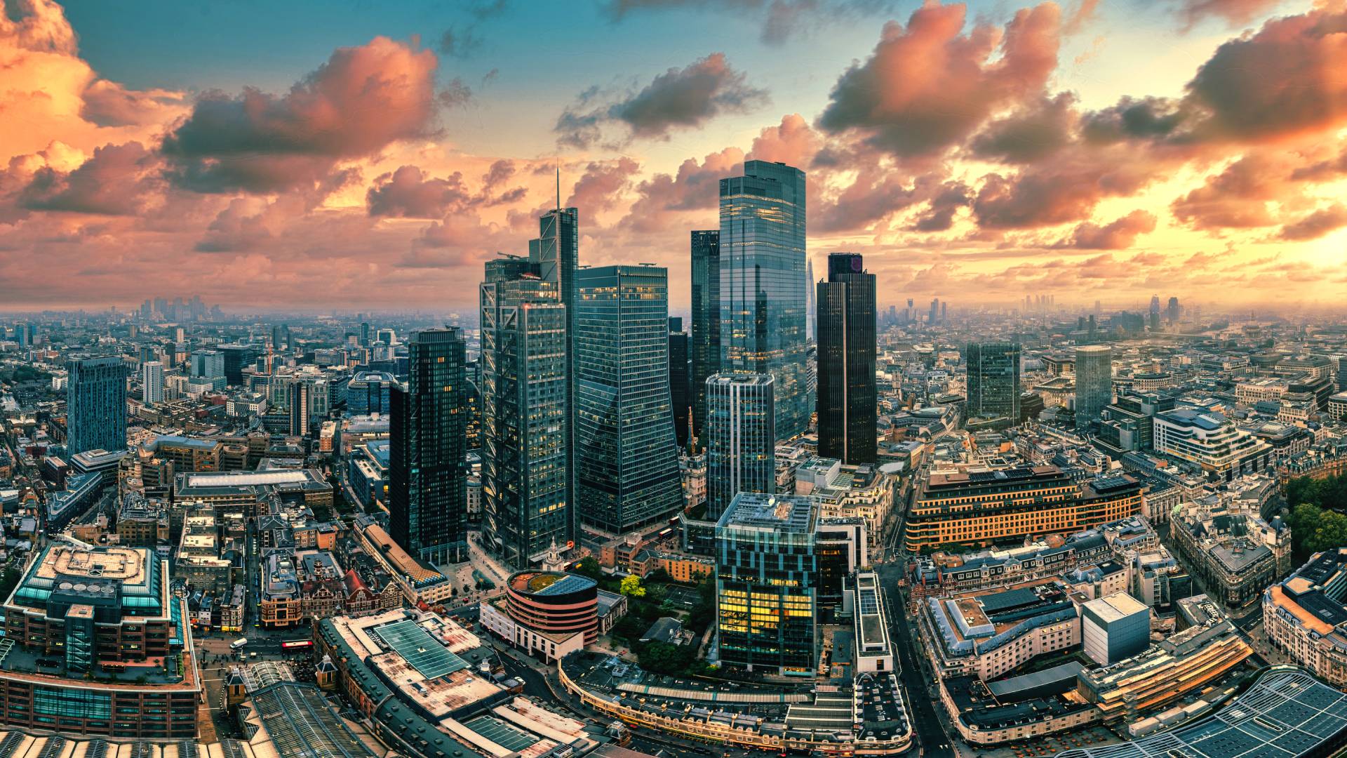 A web designer within easy reach of London London skyline at sunset